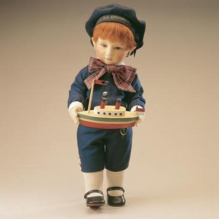Captain Corey - felt doll child with a toy boat