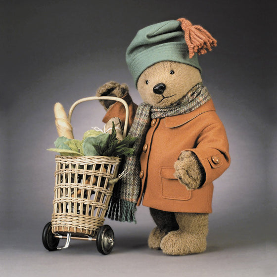 Name: Paddington Goes To Market™ Outfit Description: Fully-lined felt overcoat with leather buttons, felt hat, and Scottish wool scarf. Includes custom-made wicker market cart with metal and rubber wheels.