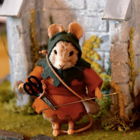 Mouse doll dressed as the brave little tailor