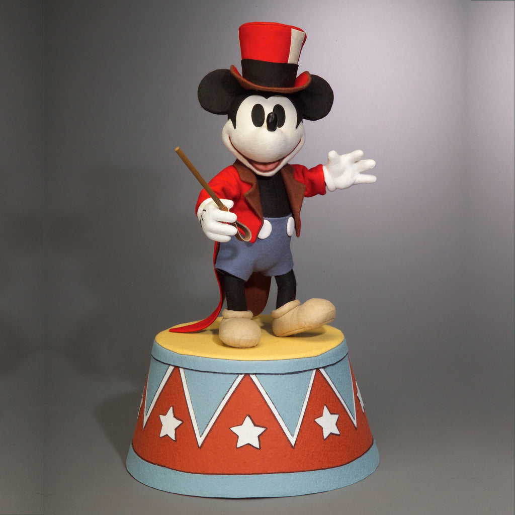 Mickey Mouse felt doll on top of circus stage
