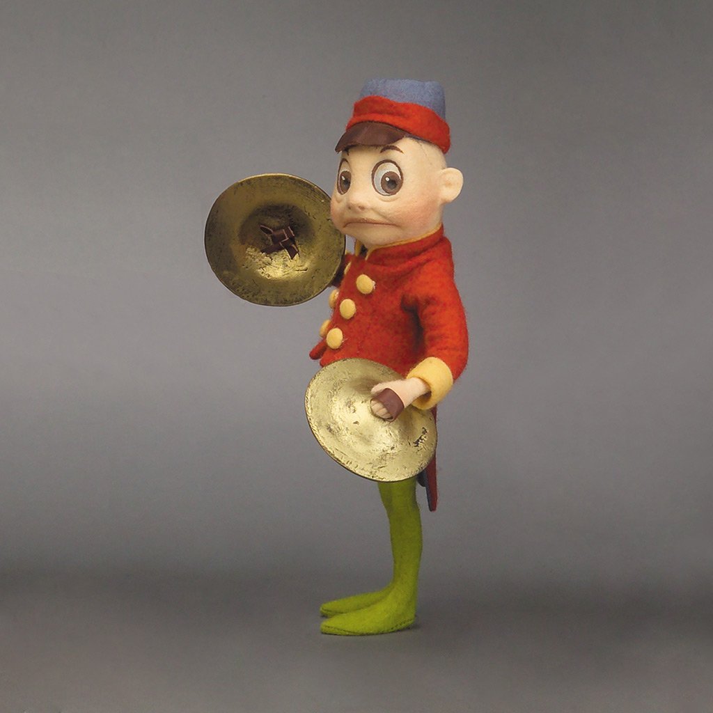 Cymbals Brownie™ felt doll dressed for marching band