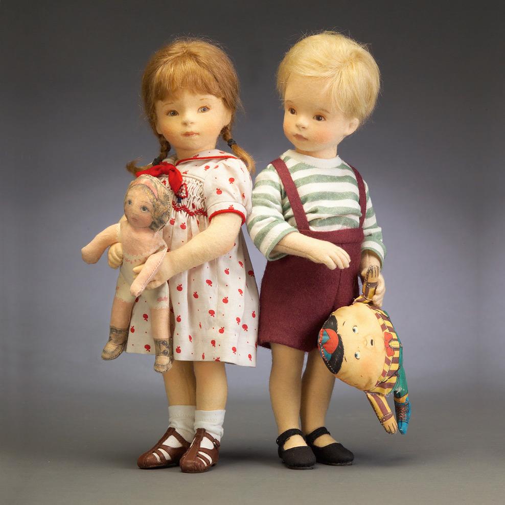 molded felt dolls of young children with toys