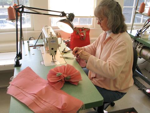 Red Clover Fairy dresses being sewn during production